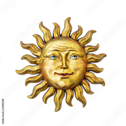 Golden sun face symbol with sunrays isolated on white. Wooden decor ornament symbol painted on gold paint. Summer weather and heat sign