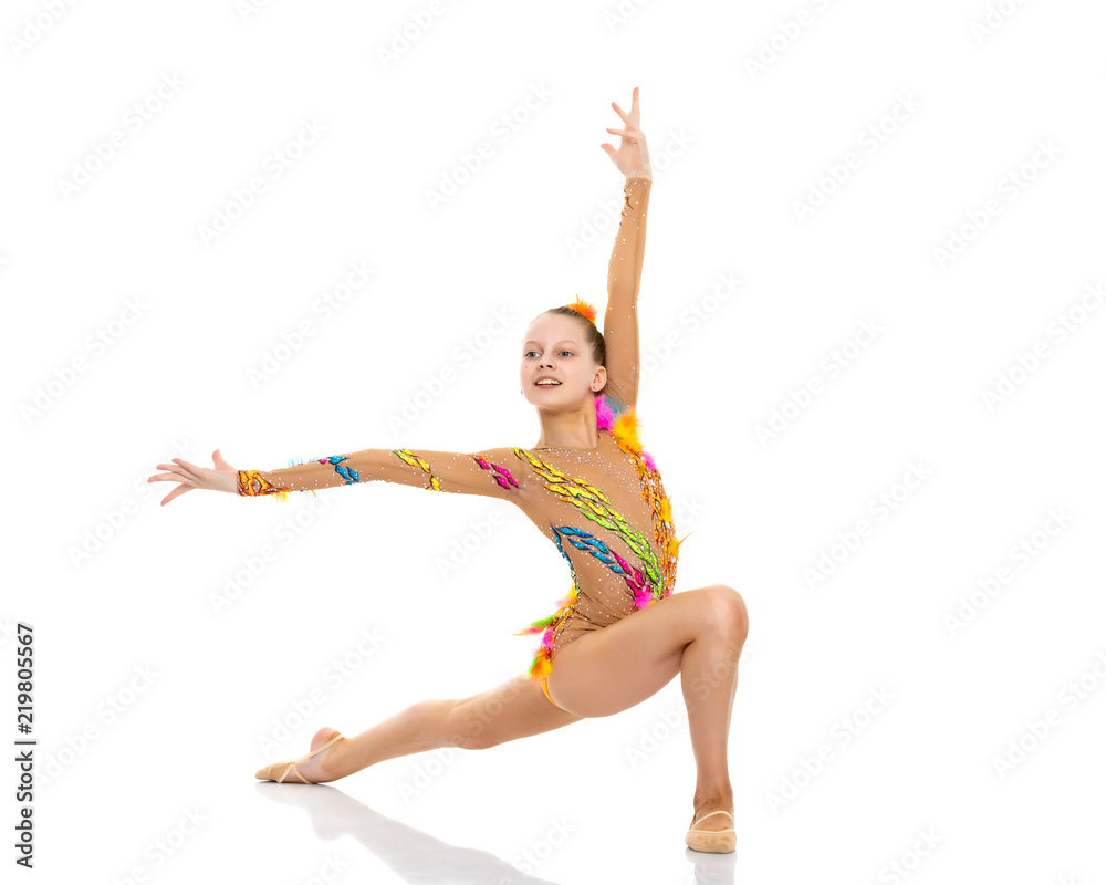 Fototapeta premium The gymnast perform an acrobatic element on the floor.