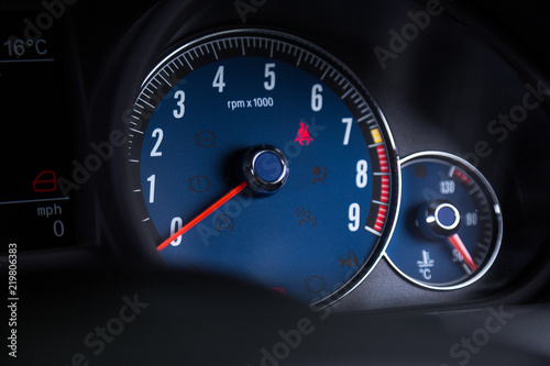 Close up of blue speedometer in sports car