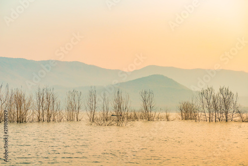 Fisherman lifestyle in the early morning with lake lanscape