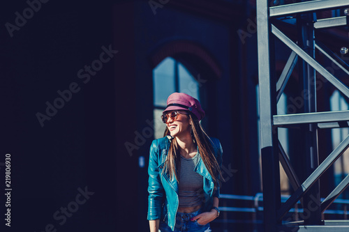 Stylish fashion portrait of brunette woman in hat. Posing in the city. copy space © jozzeppe777