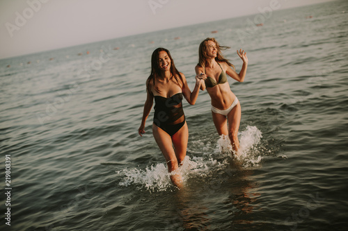 Pretty young women having f...