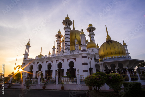 Beautiful Sunset Scenery at Royal Mosque Kuala Kangsar,Malaysia in Sillhoutte.Soft Focus,Blur due to Long Exposure.Visible Noise due to High ISO.