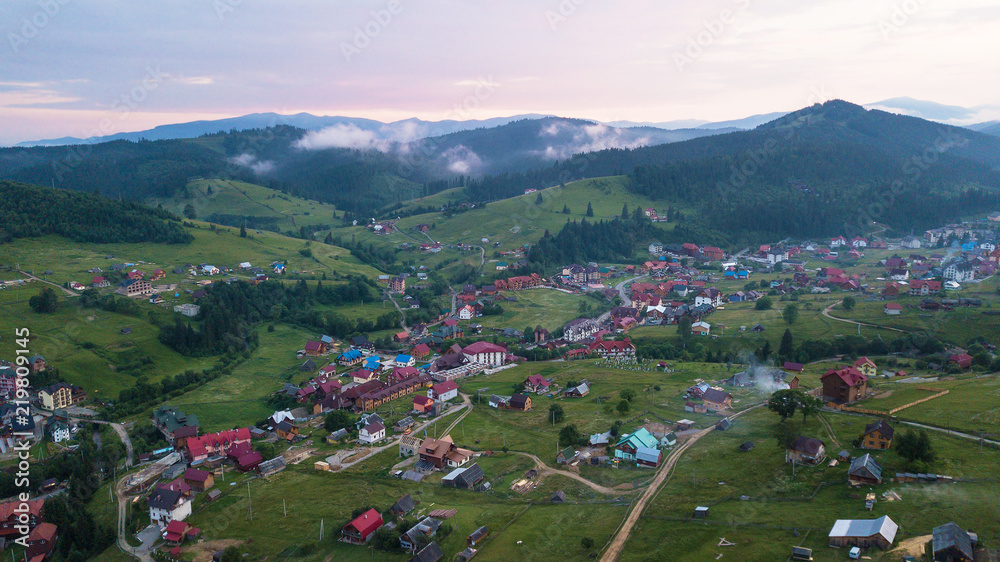 Village in the mountains from a bird's eye view during sunset