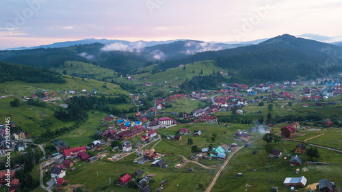Village in the mountains from a bird's eye view during sunset