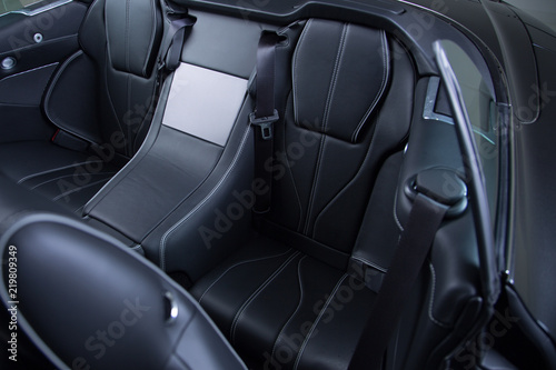 Black leather passenger seat of convertible sports car © camerarules