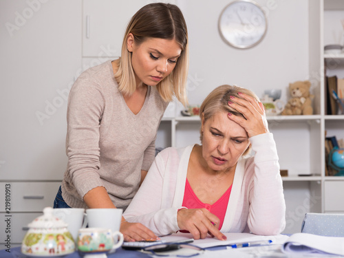 mother and her adult daughter with financial problems