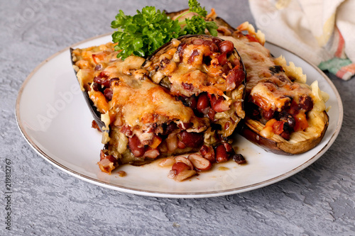 Half baked eggplants stuffed with vegetables and beans