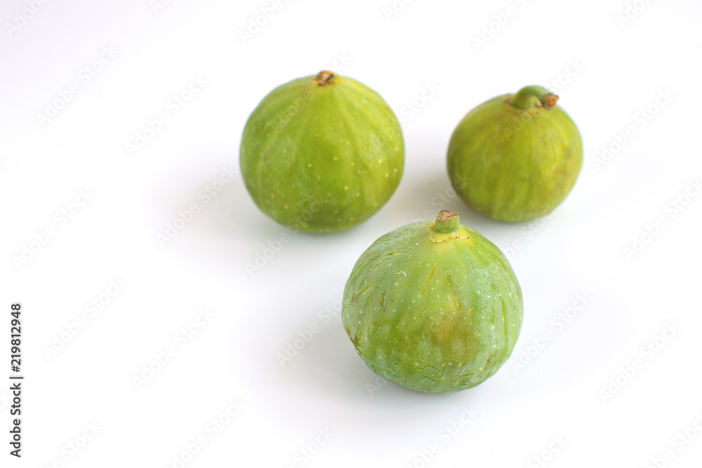 Fresh green figs Isolated White background Copy space Autumn Fall Local market concept Fresh green figs Isolated White background Copy space Autumn Fall Local market concept