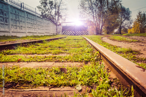 Old railroad with grass filtred photo