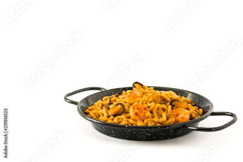 Traditional Spanish fideua. Noodle paella isolated on white background. Copyspace