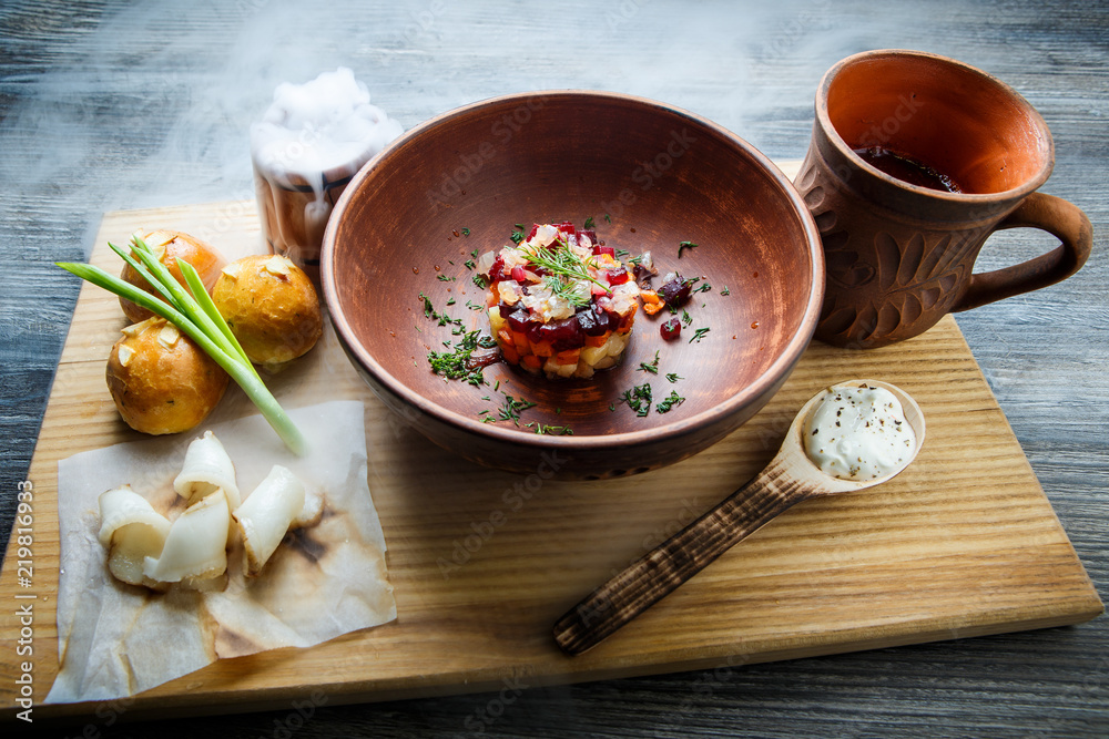 wooden table topped with plates of traditional ukrainian food wooden table topped with plates of traditional ukrainian food