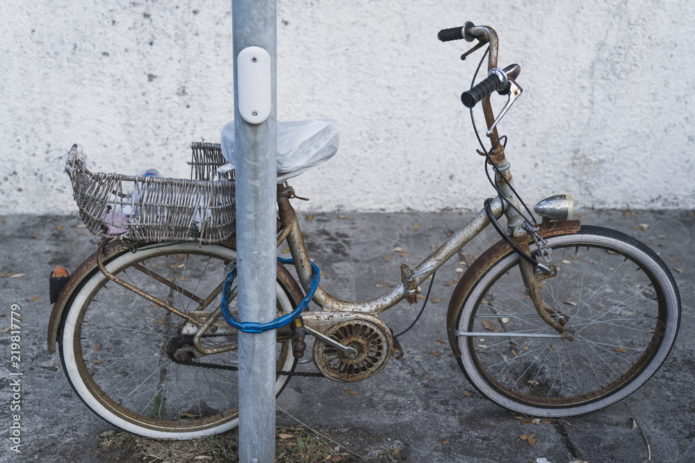 Vintage bicycle parking with shopping basket
