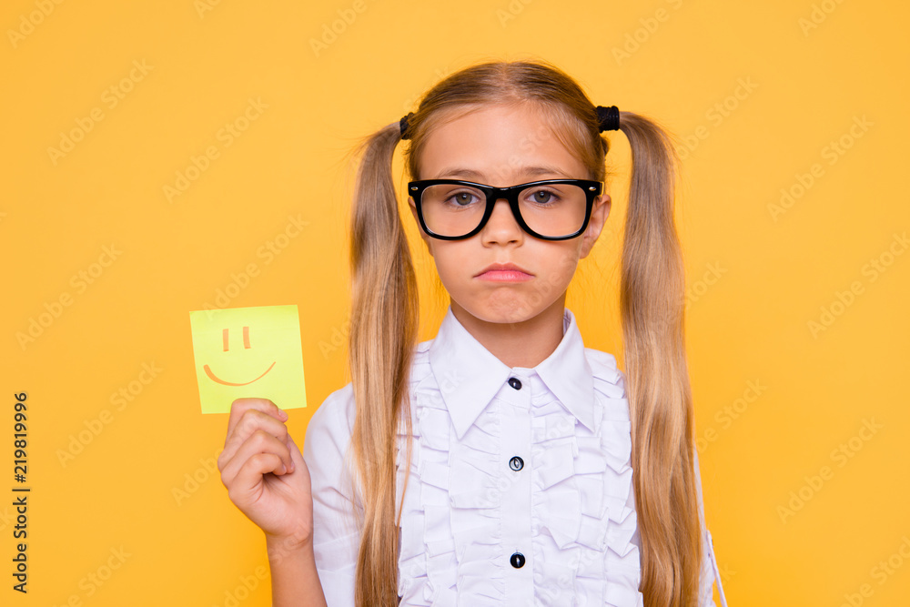 It's not interesting! Boredom courses pessimism concept. Close up photo portrait of upset pessimistic depressive gloomy negative girl holding positive sticker isolated bright background It's not interesting! Boredom courses pessimism concept. Close up photo portrait of upset pessimistic depressive gloomy negative girl holding positive sticker isolated bright background