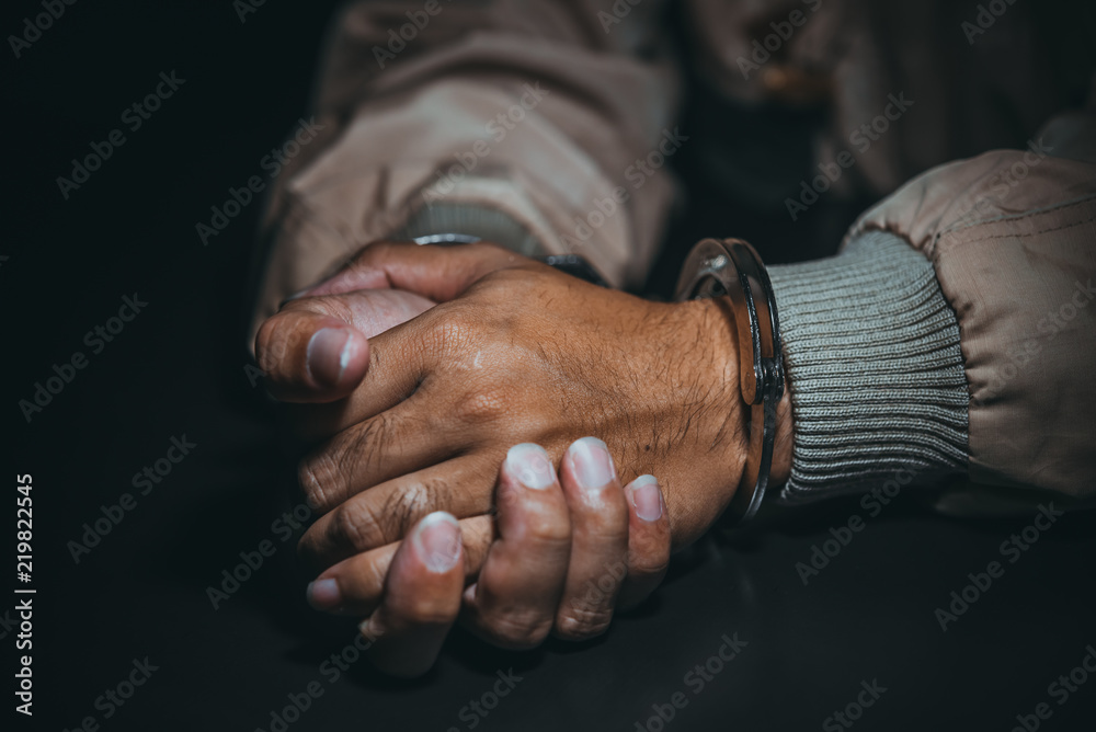 Fototapeta premium The suspect was arrested at the investigation, interview to find out the truth, the thief was caught by the police come to the dark room,Thailand people