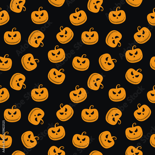Halloween seamless pattern with scary stare pumpkin on black background. Design for background, wallpaper or gift wrapping paper.