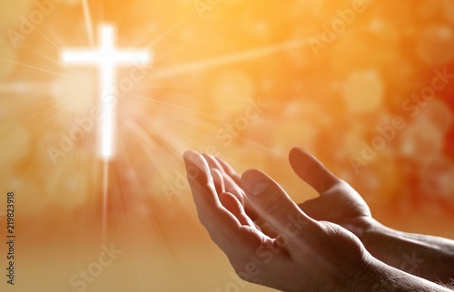 Hands of human praying on blurred background