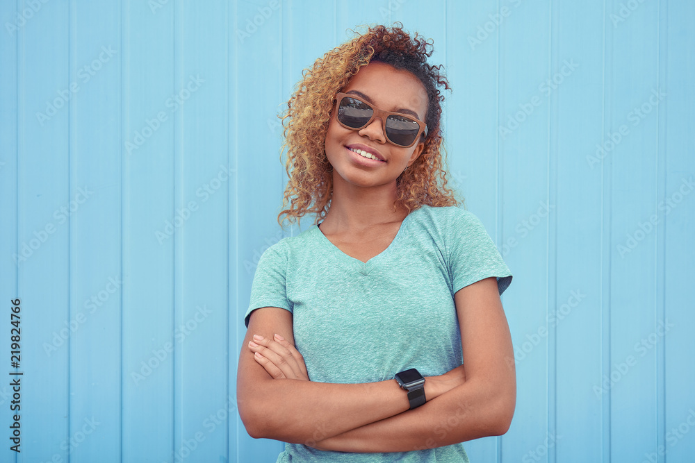 Portrait of smiling black girl wearing sunglasses