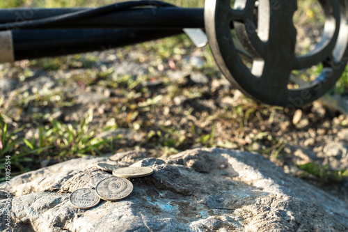 metal detector and old coins of the USSR times on the stone