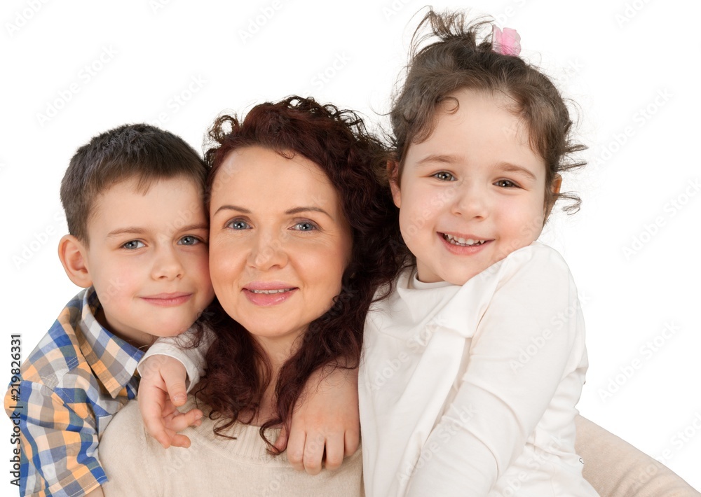 Happy Mother with daughter and son hugging on background Happy Mother with daughter and son hugging on background