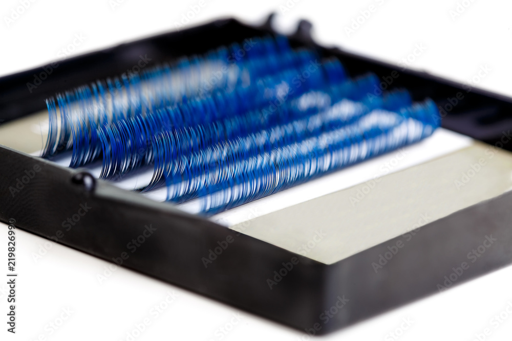 Eyelash Extension tools on white background. Accessories for eyelash extensions. Close-up. Macro. Artificial Blue ombre lashes. Eyelash Extension tools on white background. Accessories for eyelash extensions. Close-up. Macro. Artificial Blue ombre lashes.