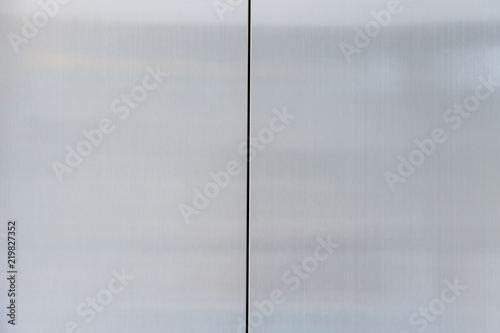 close stainless steel of elevator door. silver metal wall background and texture.