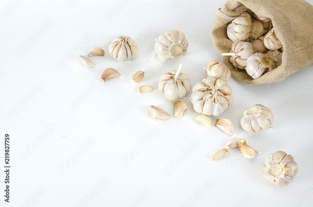 multi bulb garlic in sack on white background