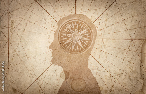 Human head and compass. The concept on the topic of navigation, psychology, morality, etc.