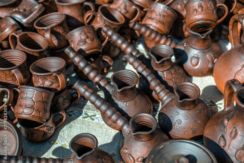 Clay dishes. Crockery made clay. Dishes background
