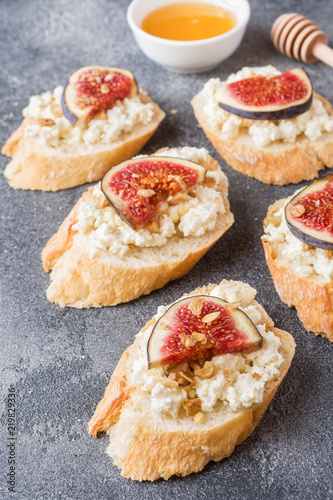 Snacks bruschetta with cottage cheese  walnut and honey and figs