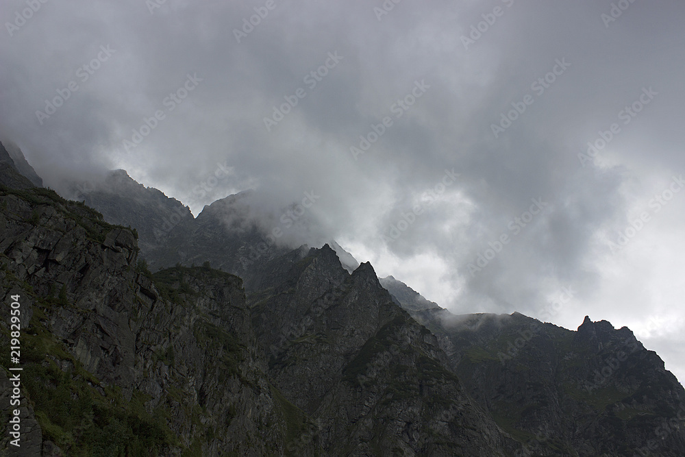 Apocalyptic view on mountains, Tatras, Poland. Clouds touch the mountains