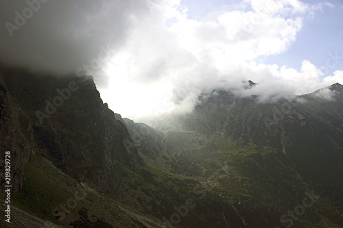 Apocalyptic view on mountains, Tatras, Poland. Clouds touch the mountains
