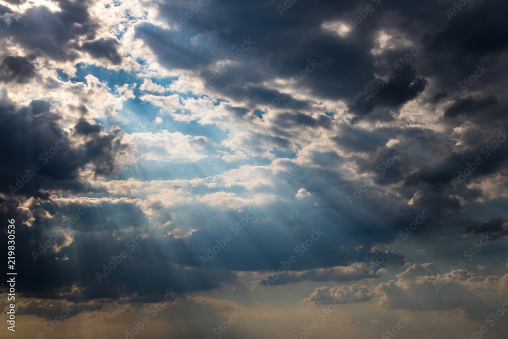 Dramatic cloudy sky with sun beams Dramatic cloudy sky with sun beams