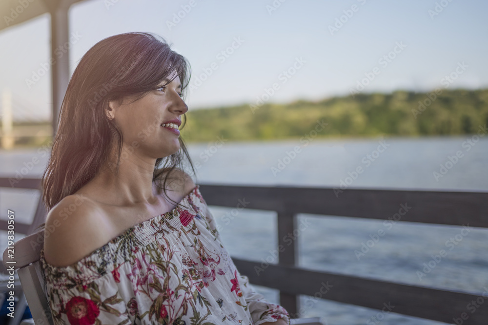Portrait of beautiful smiling young girl on sunny day in nature near river Portrait of beautiful smiling young girl on sunny day in nature near river