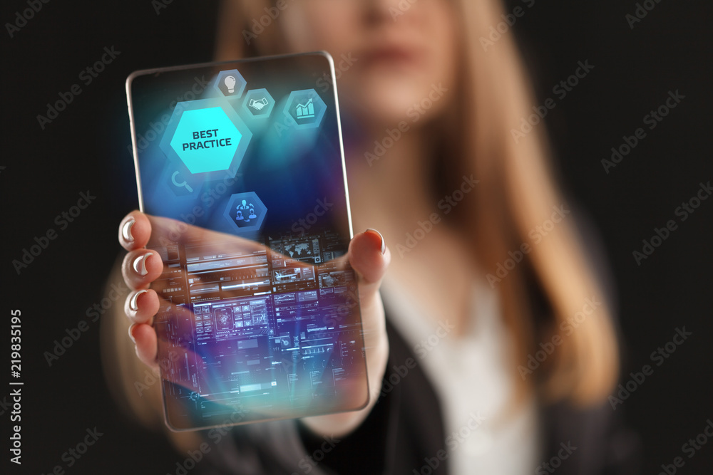 The concept of business, technology, the Internet and the network. A young entrepreneur working on a virtual screen of the future and sees the inscription: Best practice