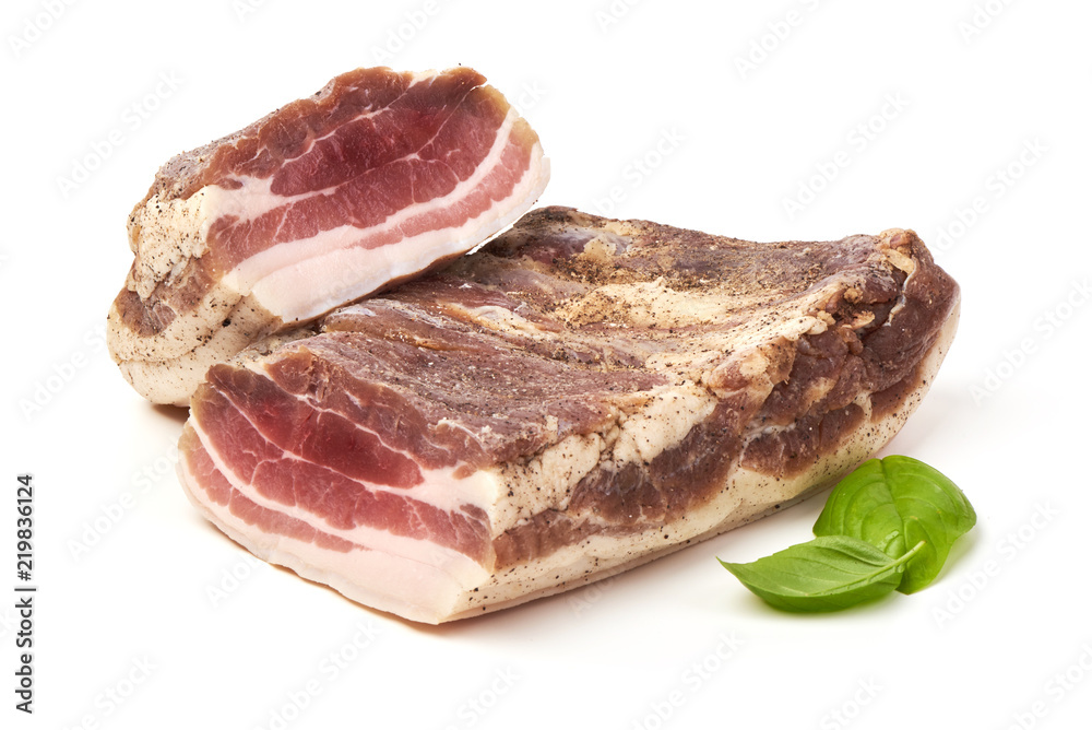 Smoked rustic farmer meat with basil leaves, isolated on white background. Smoked rustic farmer meat with basil leaves, isolated on white background.