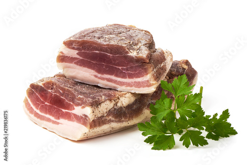 Smoked rustic farmer meat with parsley leaf, isolated on white background.