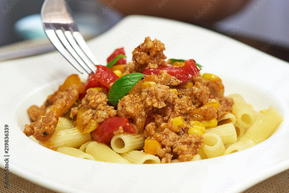 American food. Pasta alla genovese. Pasta with corn, fried meat and sauce. American food. Pasta alla genovese. Pasta with corn, fried meat and sauce.