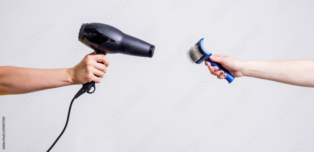Groomers holding tools at the hands. Groomers holding tools at the hands.