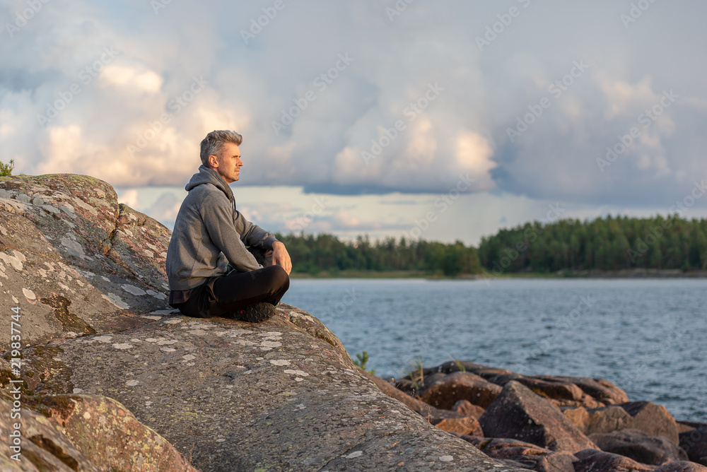 Man sitting by the lake