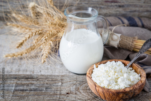 Selection of dairy products on rustic wood background photo