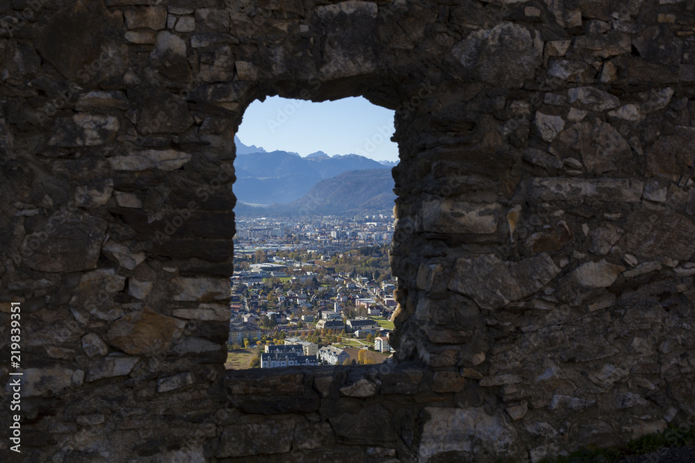 A view to the city of Villach throug the window of Burg Landskron castle