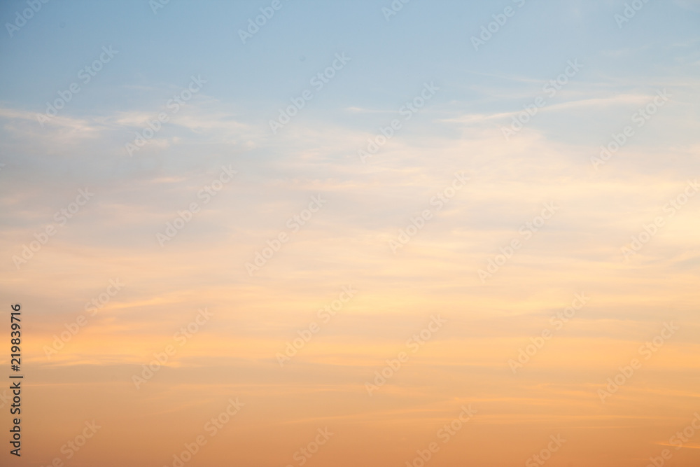 Sunset sky with golden clouds