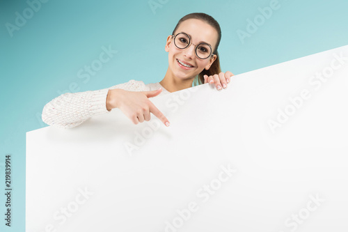 Attractive young woman with blank banner