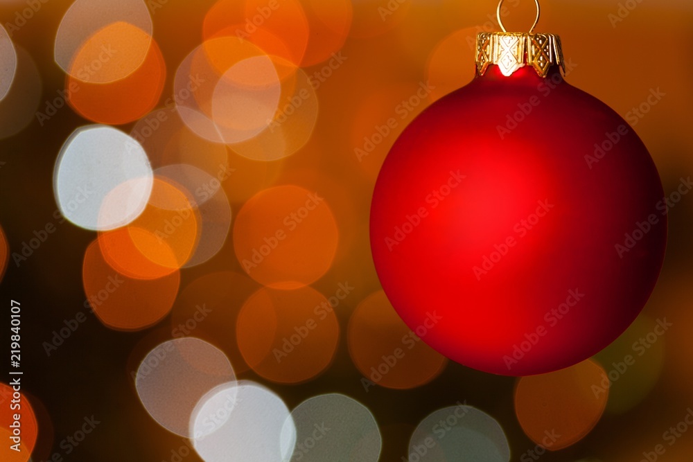 Christmas Bauble Hanging with the Red Blurry Light on the Christmas Bauble Hanging with the Red Blurry Light on the