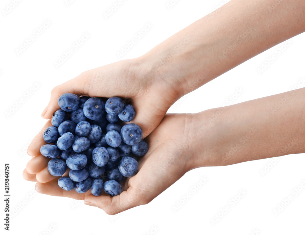 Woman holding fresh ripe blueberries on white background, closeup view Woman holding fresh ripe blueberries on white background, closeup view