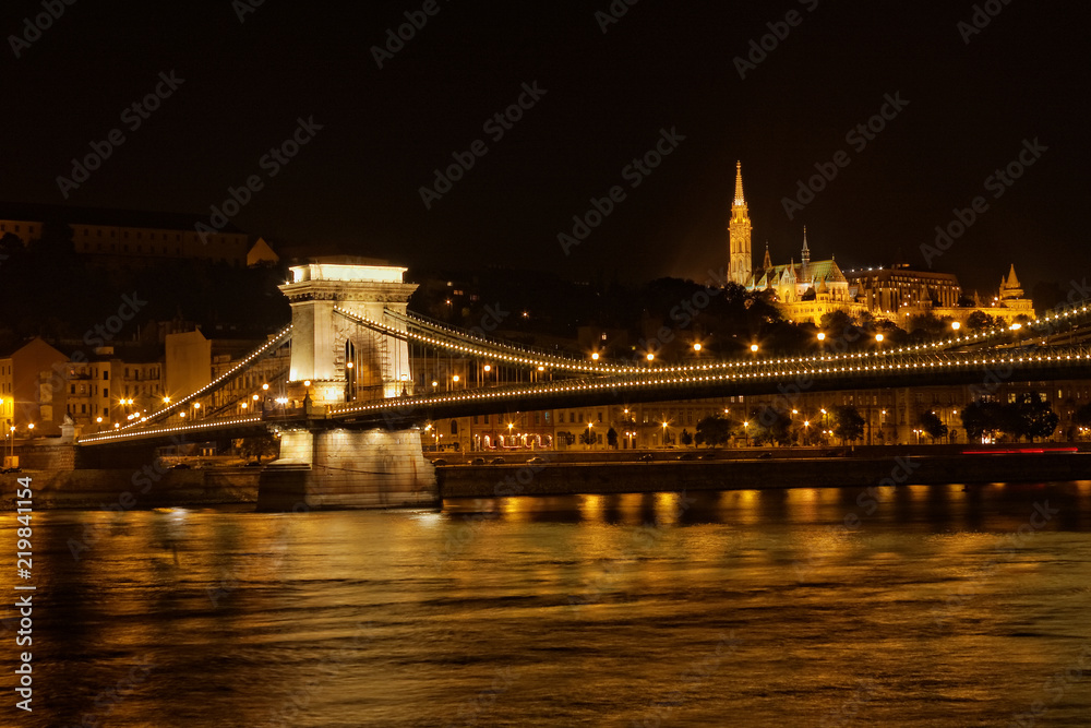 Night scene of Chain Bridge over Danube river and Fisherman's Bastion in the background