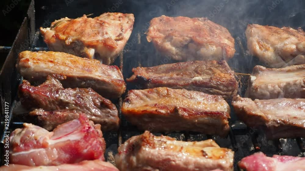 Roasted Juicy meat cooked over the coals on a barbecue Roasted Juicy meat cooked over the coals on a barbecue