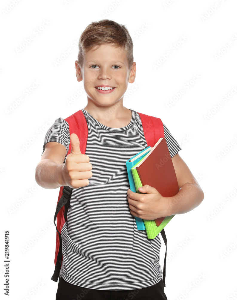 Cute boy with school stationery showing thumb up on white background Cute boy with school stationery showing thumb up on white background