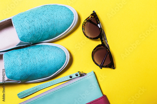 fashionable accessories for ladies. modern sunglasses, colored bag and aquamarine shoes. Spring summer hipster trend. Top view. mockup for instagram. free space for text photo